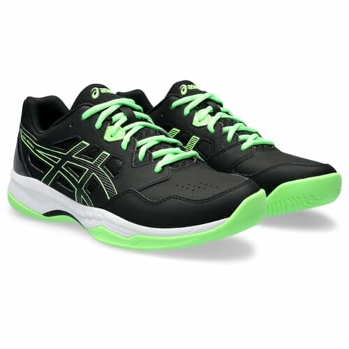 Black and green sports shoes with white soles.