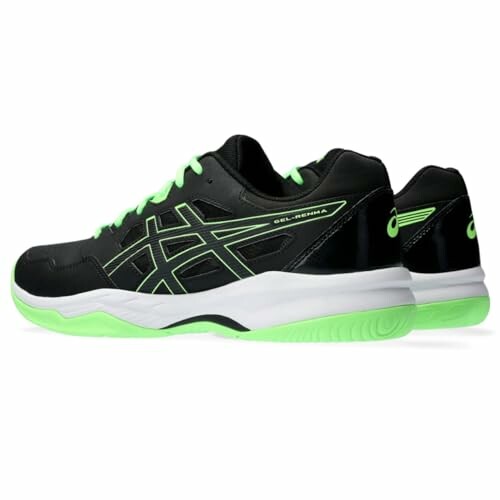 Black and green tennis shoe with white sole