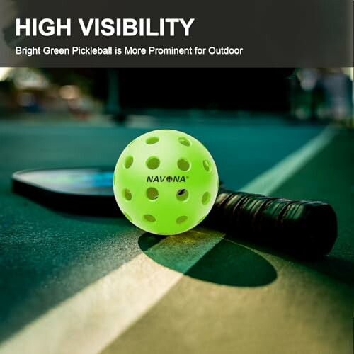 Bright green pickleball and paddle on court.