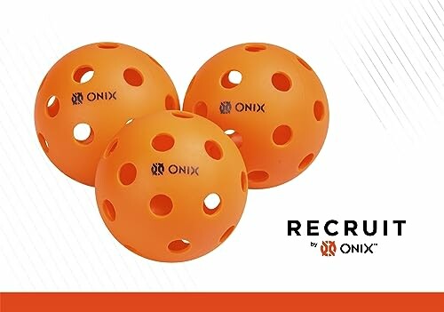 Three orange Onix pickleball balls with holes.