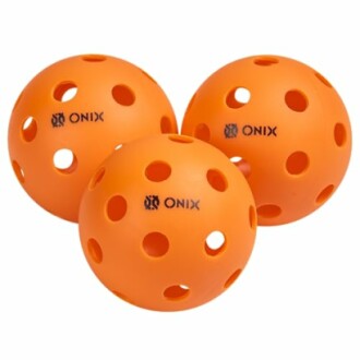 Three orange pickleball balls with holes.