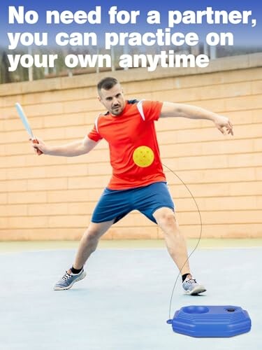 Man practicing tennis with solo training device.