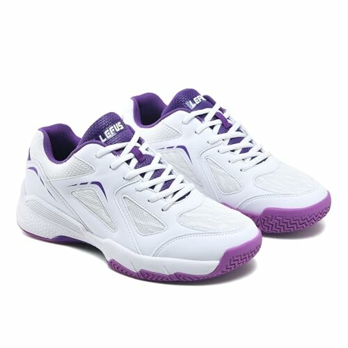 White and purple athletic sneakers with logo.