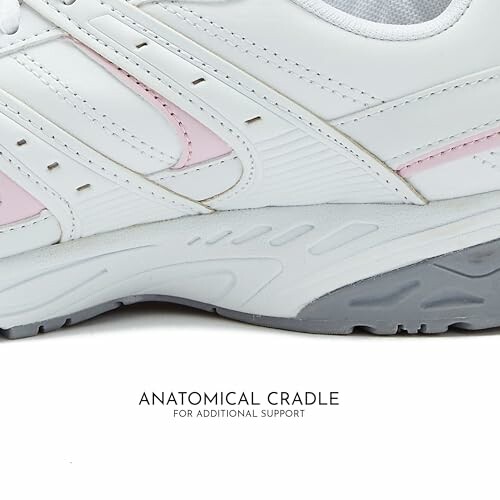 Close-up of a white sneaker with anatomical cradle feature for support.